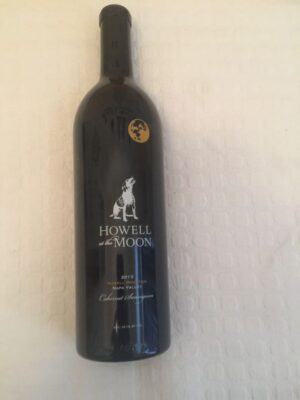 Wine bottle with moon and dog label
